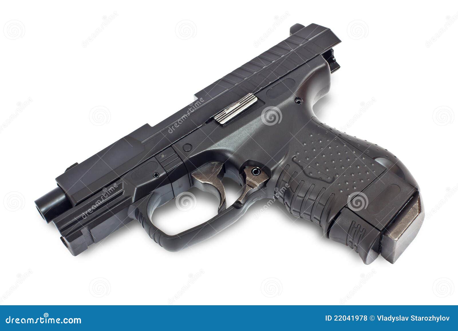 Black gun lying on a white background