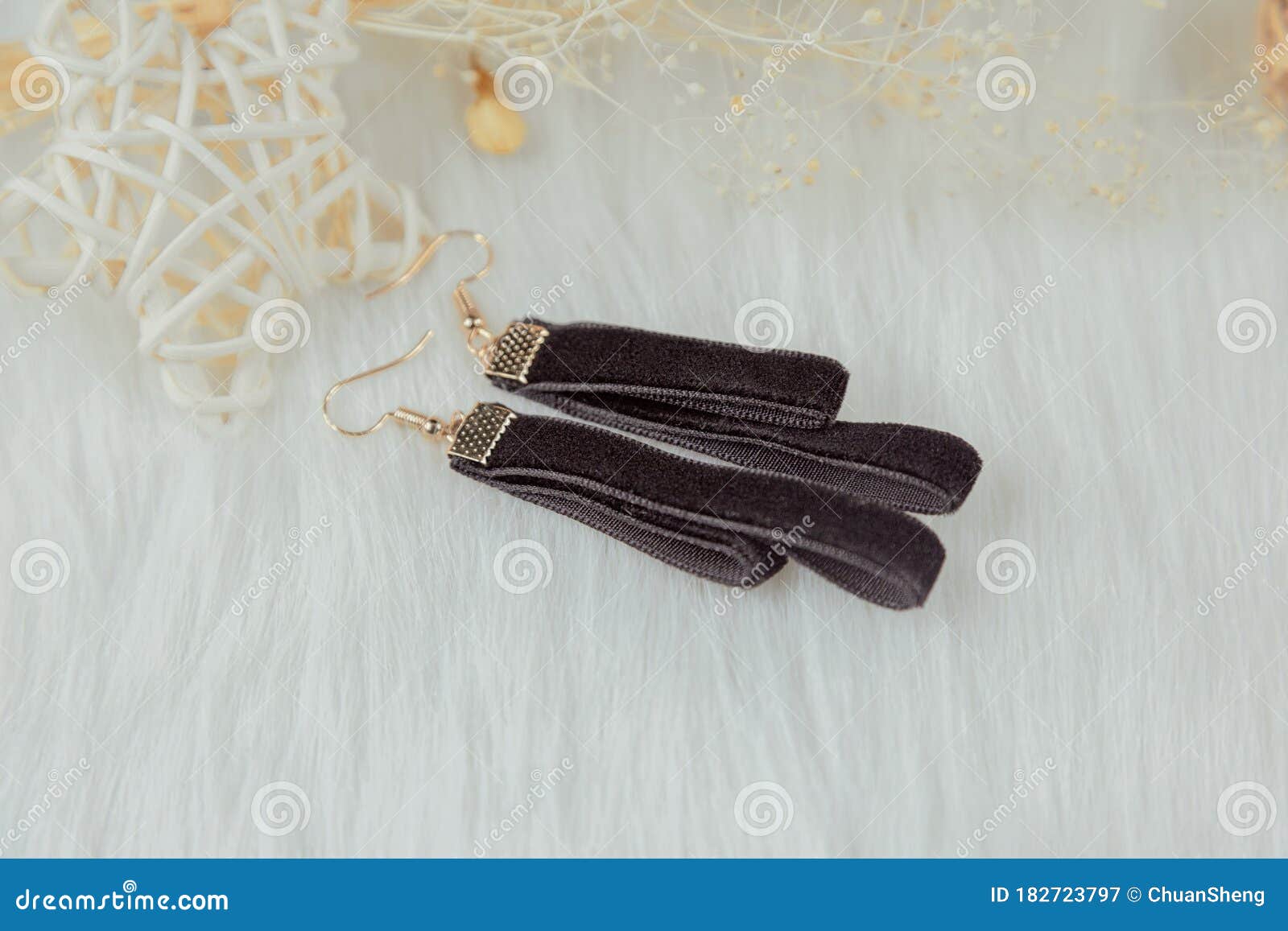 black handmade earrings matched dry yellow bouquets rattan products put white woolen blanket earrings 182723797