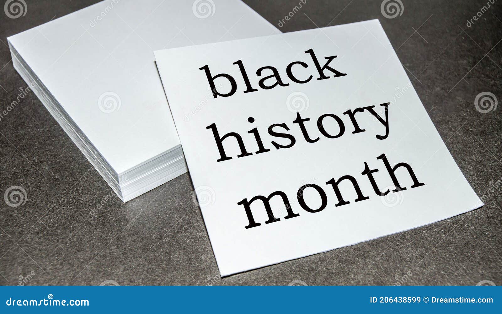 Black History Month Written on a Stack of White Paper Black Background