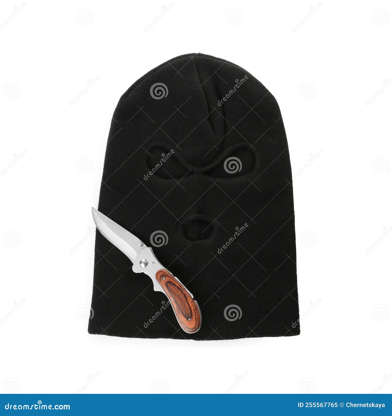 Black Knitted Balaclava and Knife on White Background, Top View Stock