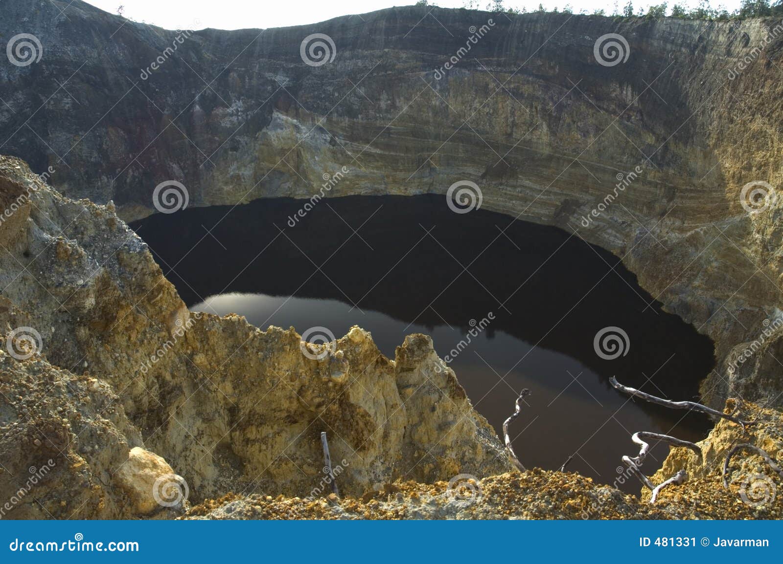 black lake in volcano crater, kelimutu, flores, indonesia