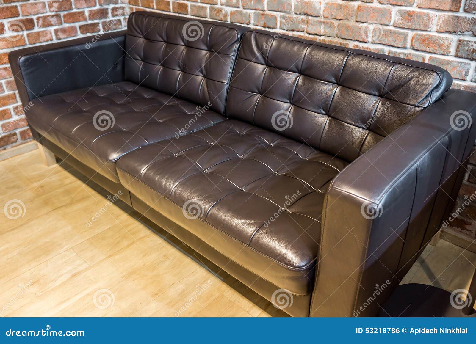 Black leather sofa stock photo. Image of knob, cushion 53218786