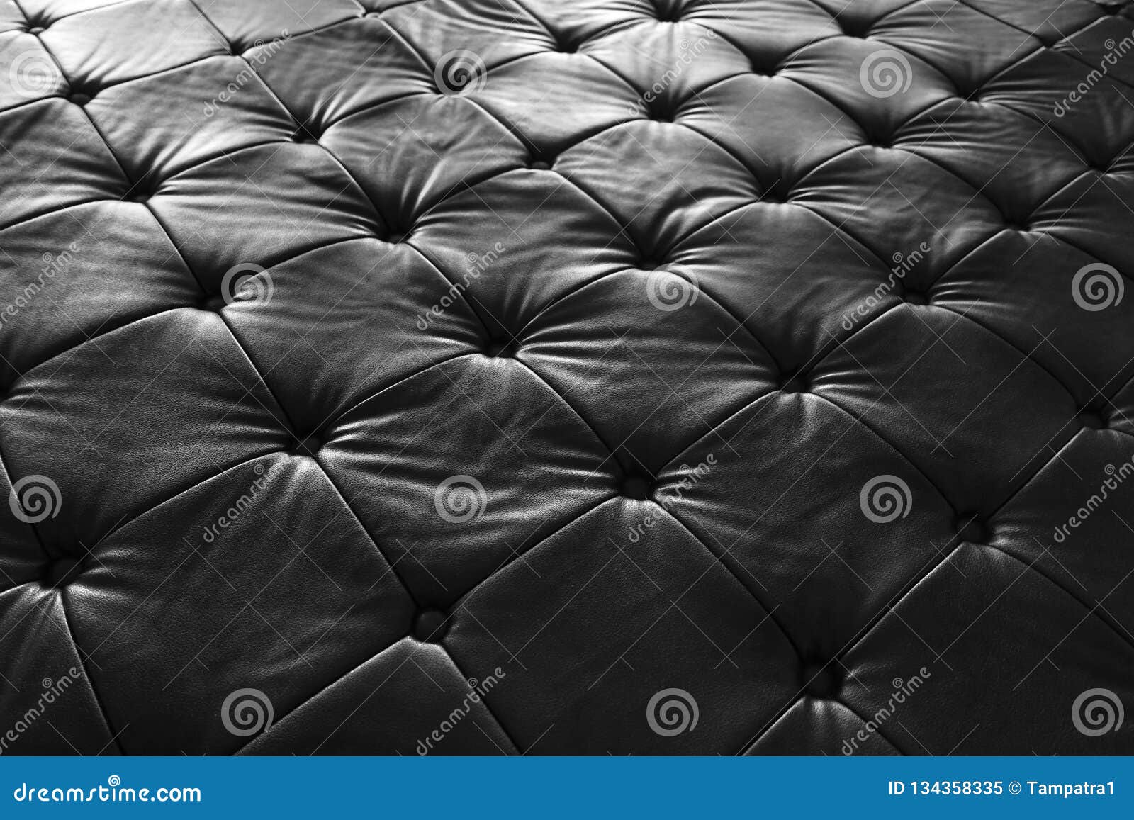 Black Leather Sofa, Pattern Surface Texture. Closeup of Interior