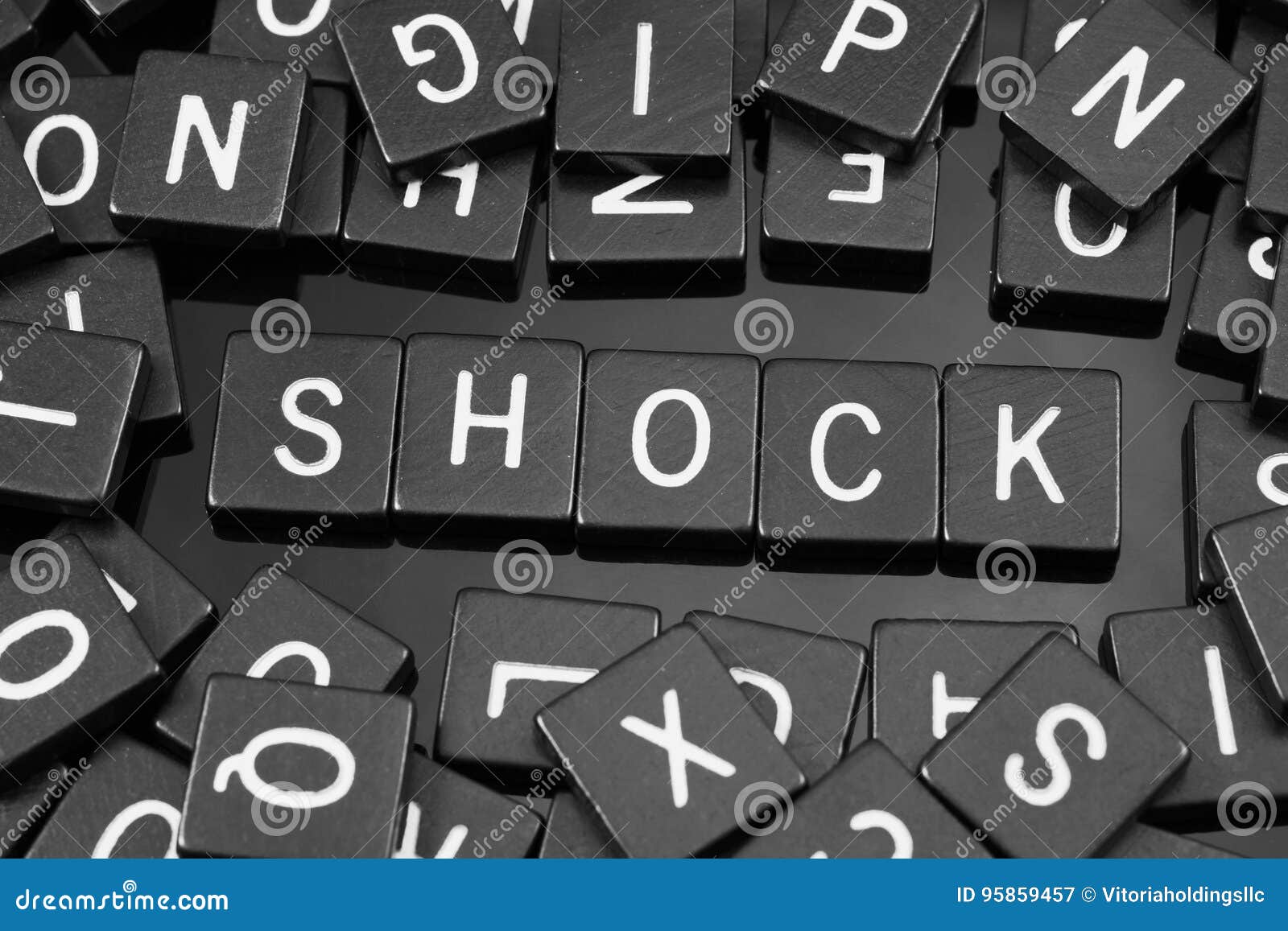 Black Letter Tiles Spelling The Word & X22;shock& X22; Stock Image