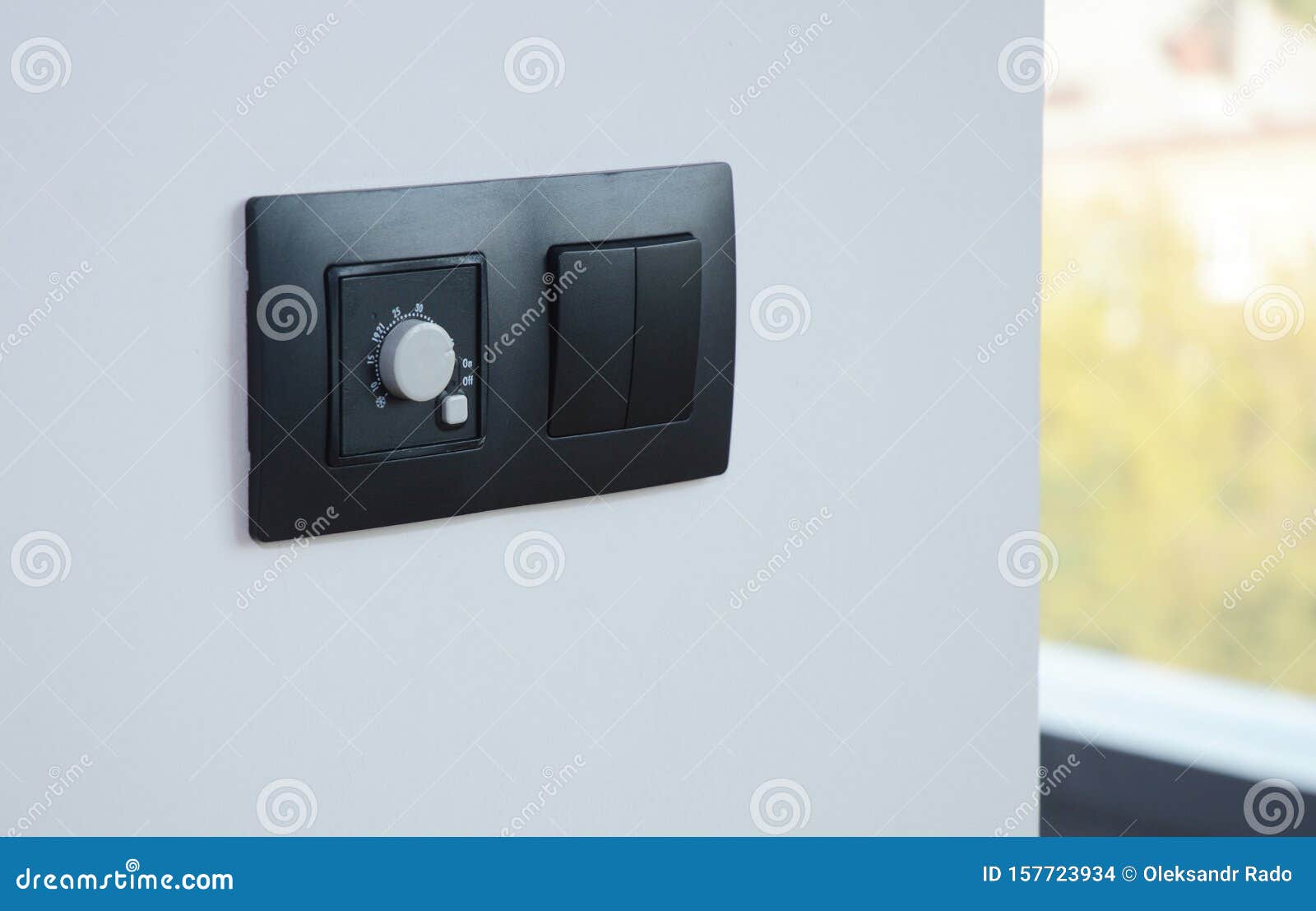 Black Light Switch on the Modern House Wall. Socket, Air Coditioning