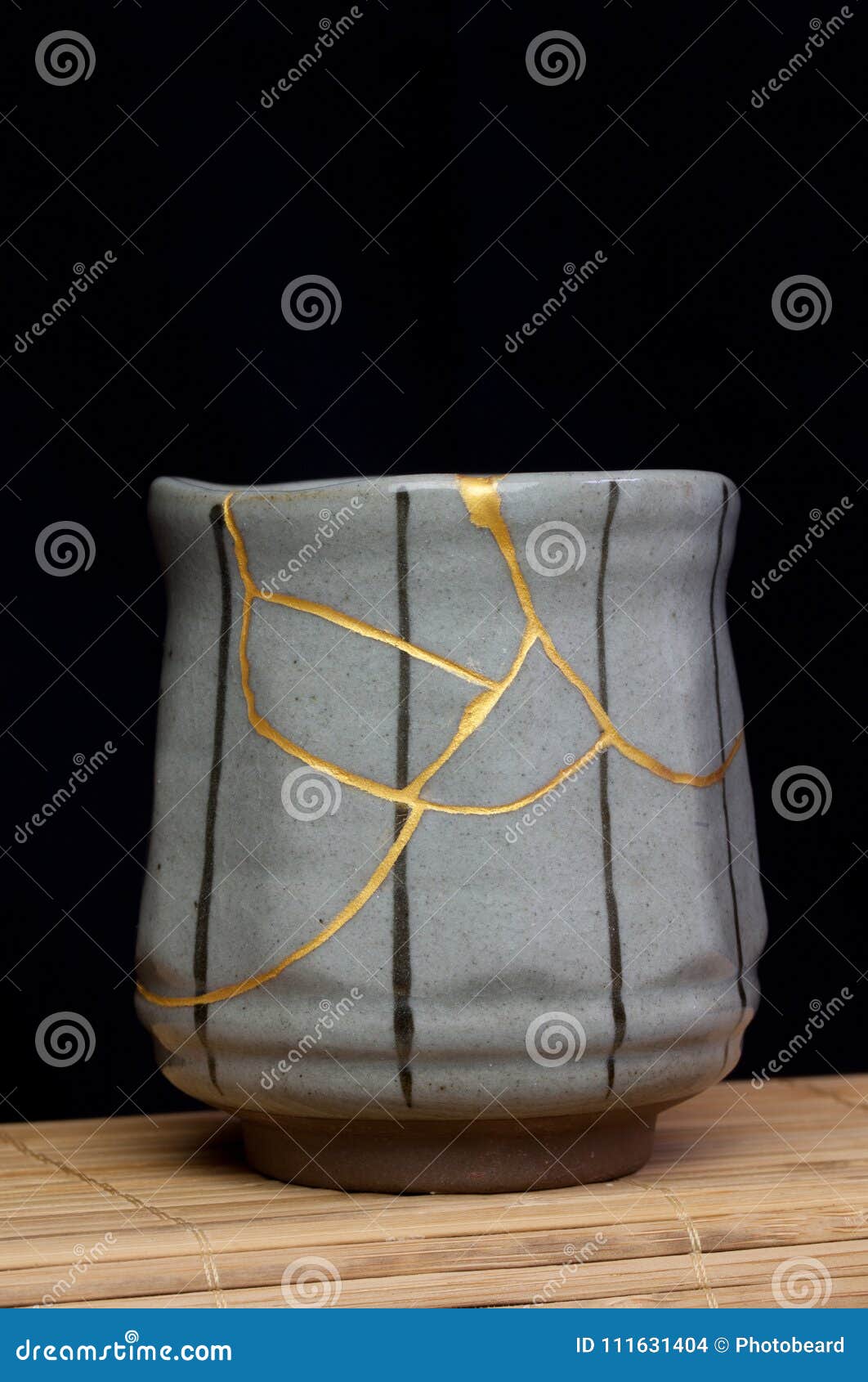 black lined gold kintsugi cup