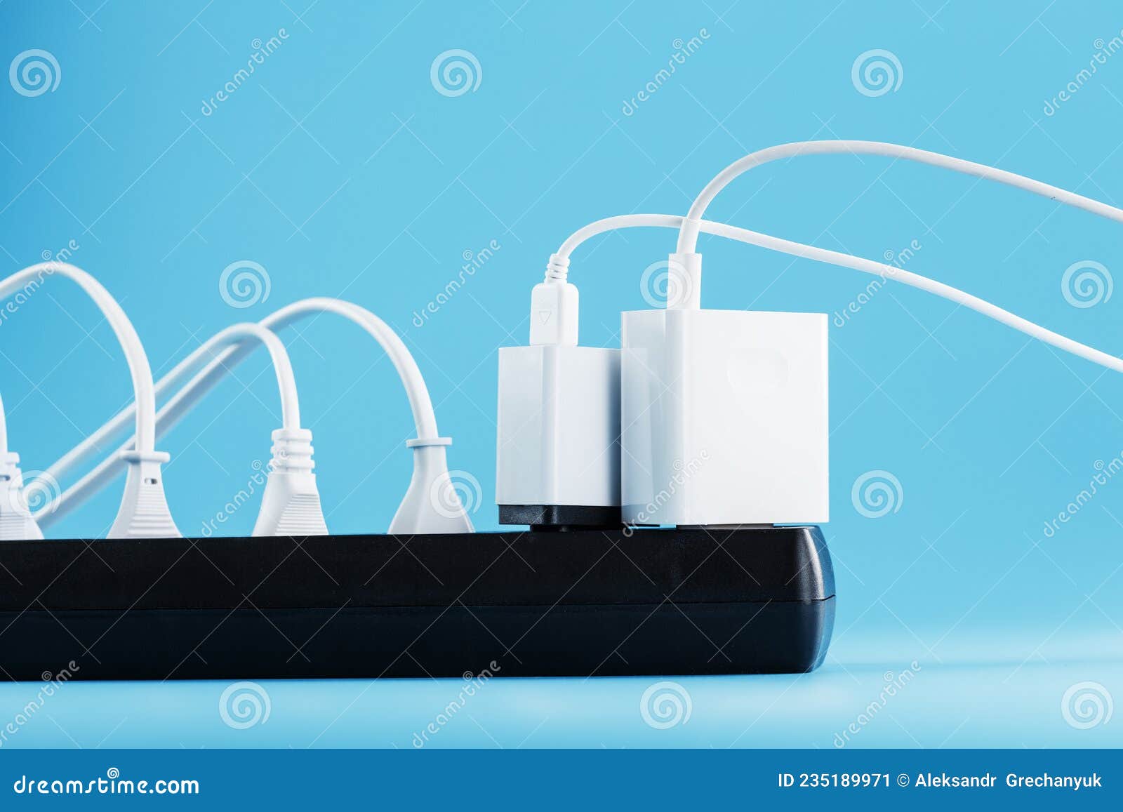 A Black Mains Filter with Electrical Outlets Inserted into it with