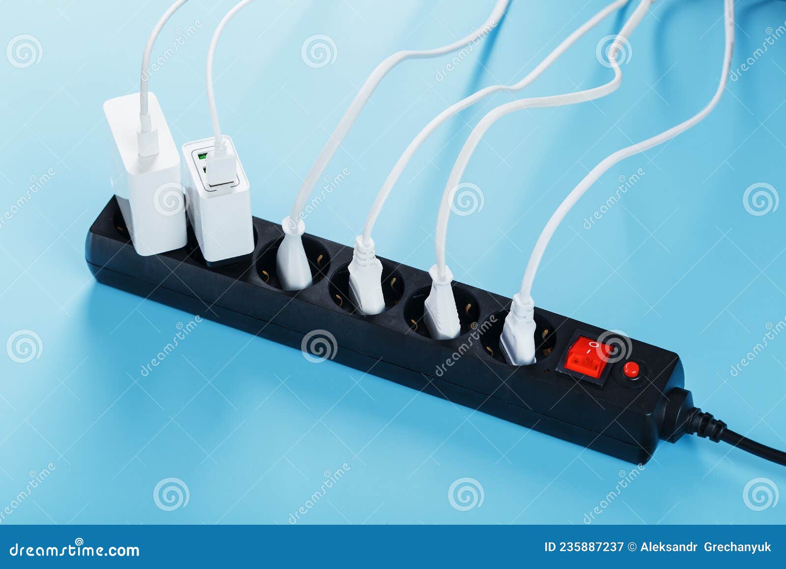 A Black Mains Filter with Electrical Outlets Inserted into it with