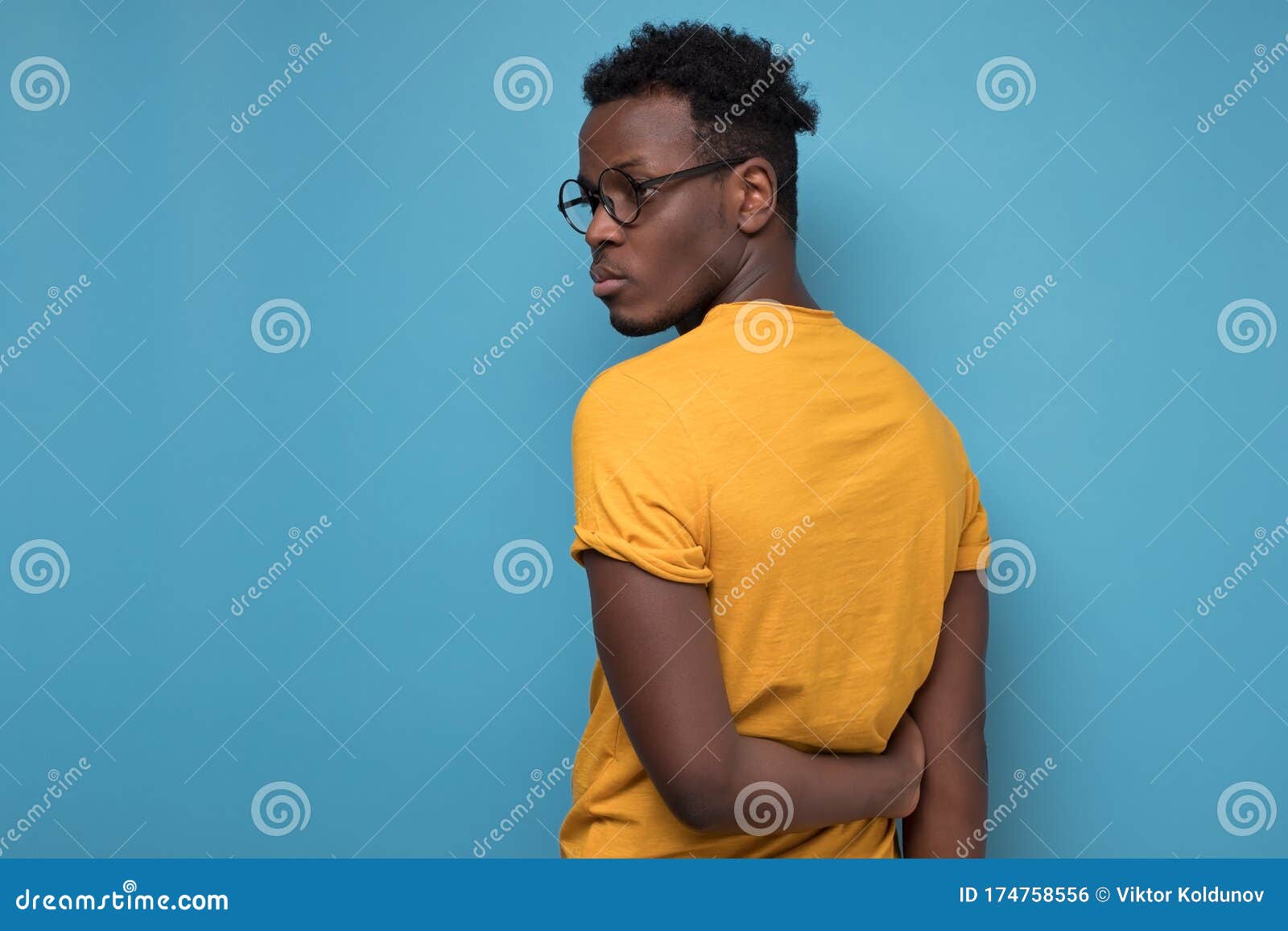 Black Man in Glasses and Yellow T-shirt Turning Back. Stock Photo ...