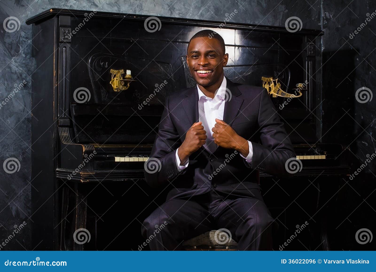 Black man near the piano stock photo. Image of music 36022096