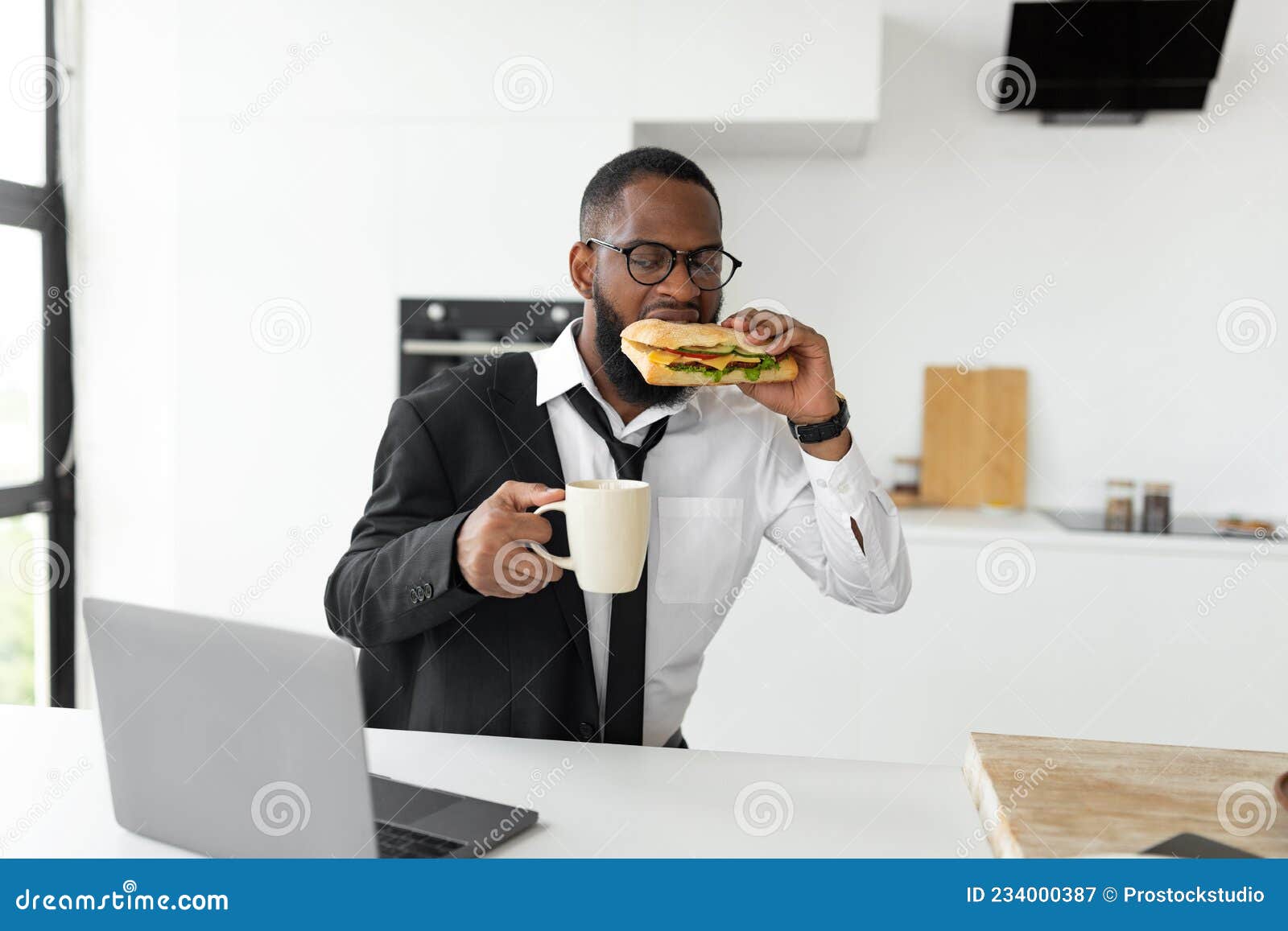 https://thumbs.dreamstime.com/z/black-man-rushing-to-work-eating-sandwich-home-portrait-busy-manager-worker-glasses-having-breakfast-kitchen-wearing-suit-234000387.jpg
