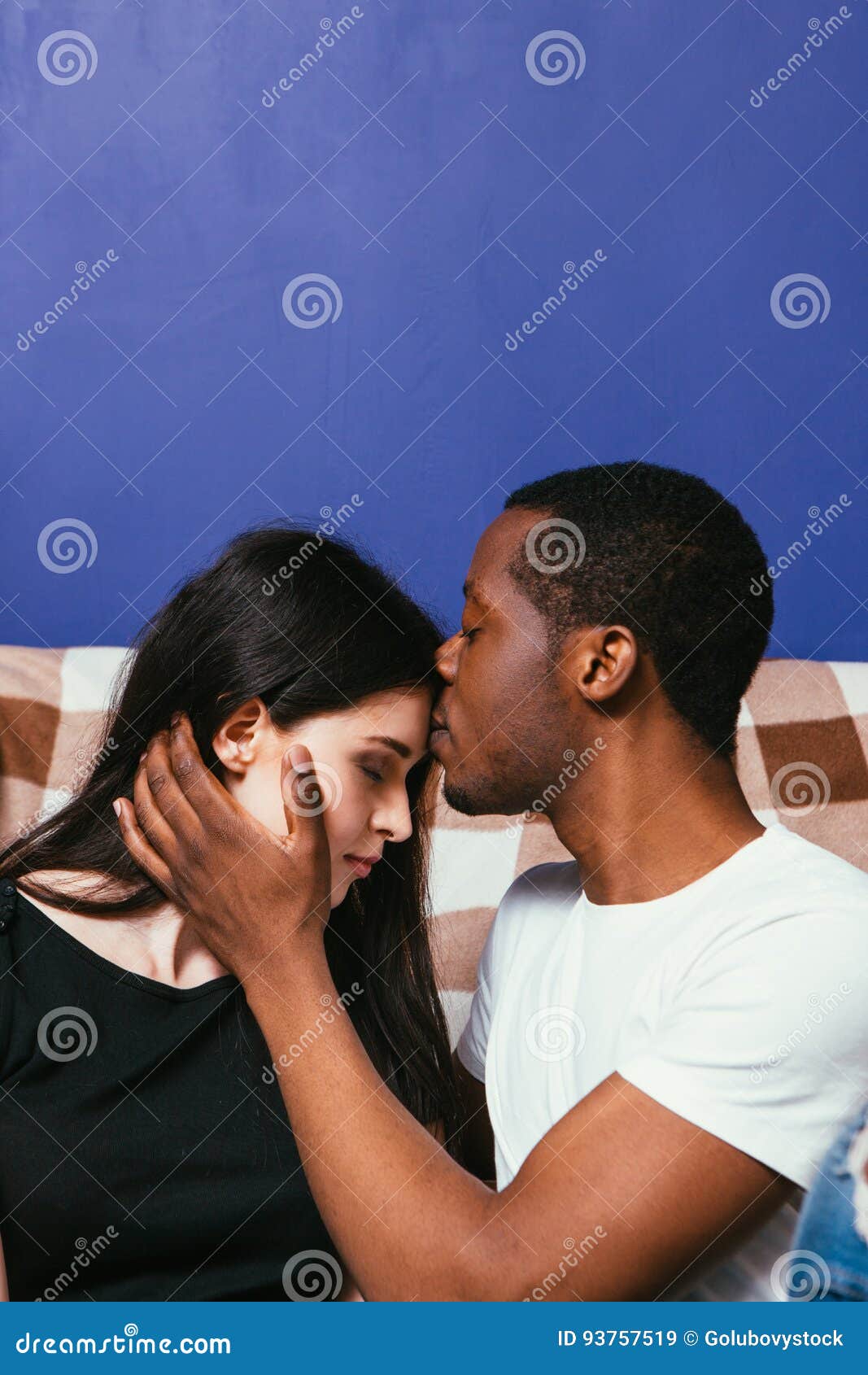 Black Man and White Woman Together, Kiss Forehead Stock Image photo