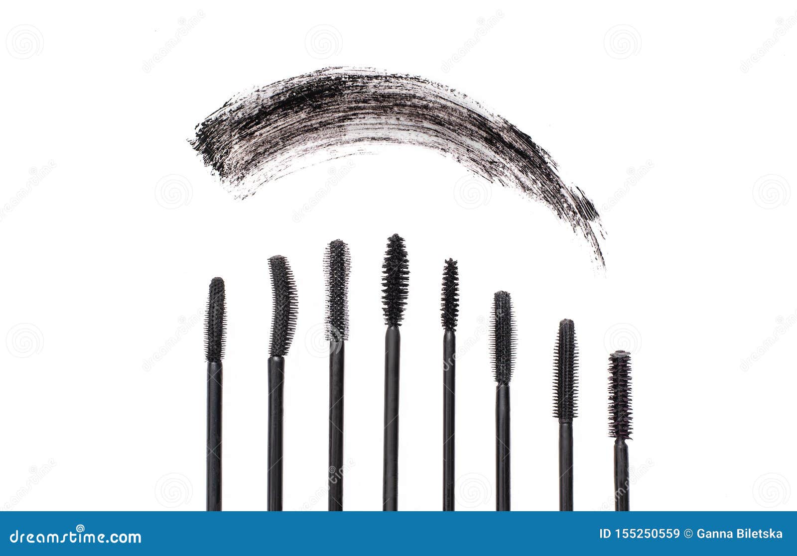 Black Mascara Smear with Different Types of Brush Brushes Stock Image