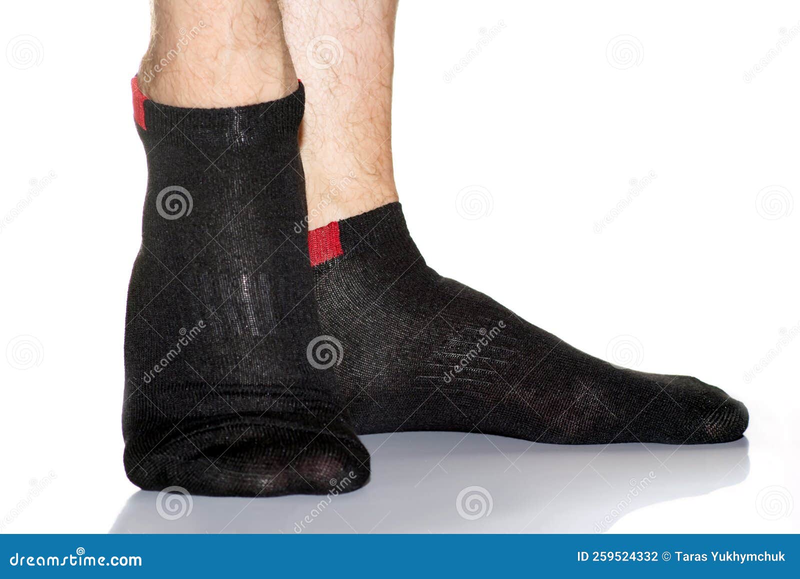 Black Men S Socks with a Red Insert on the Feet, Legs in Socks on a