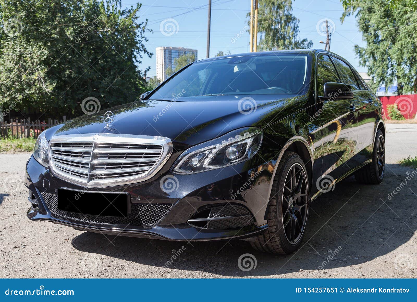 Black Mercedes Benz E Class 50 13 Year Front View With Dark Gray Interior In Excellent Condition In A Parking Space Near Green Editorial Photo Image Of Fast Automotive