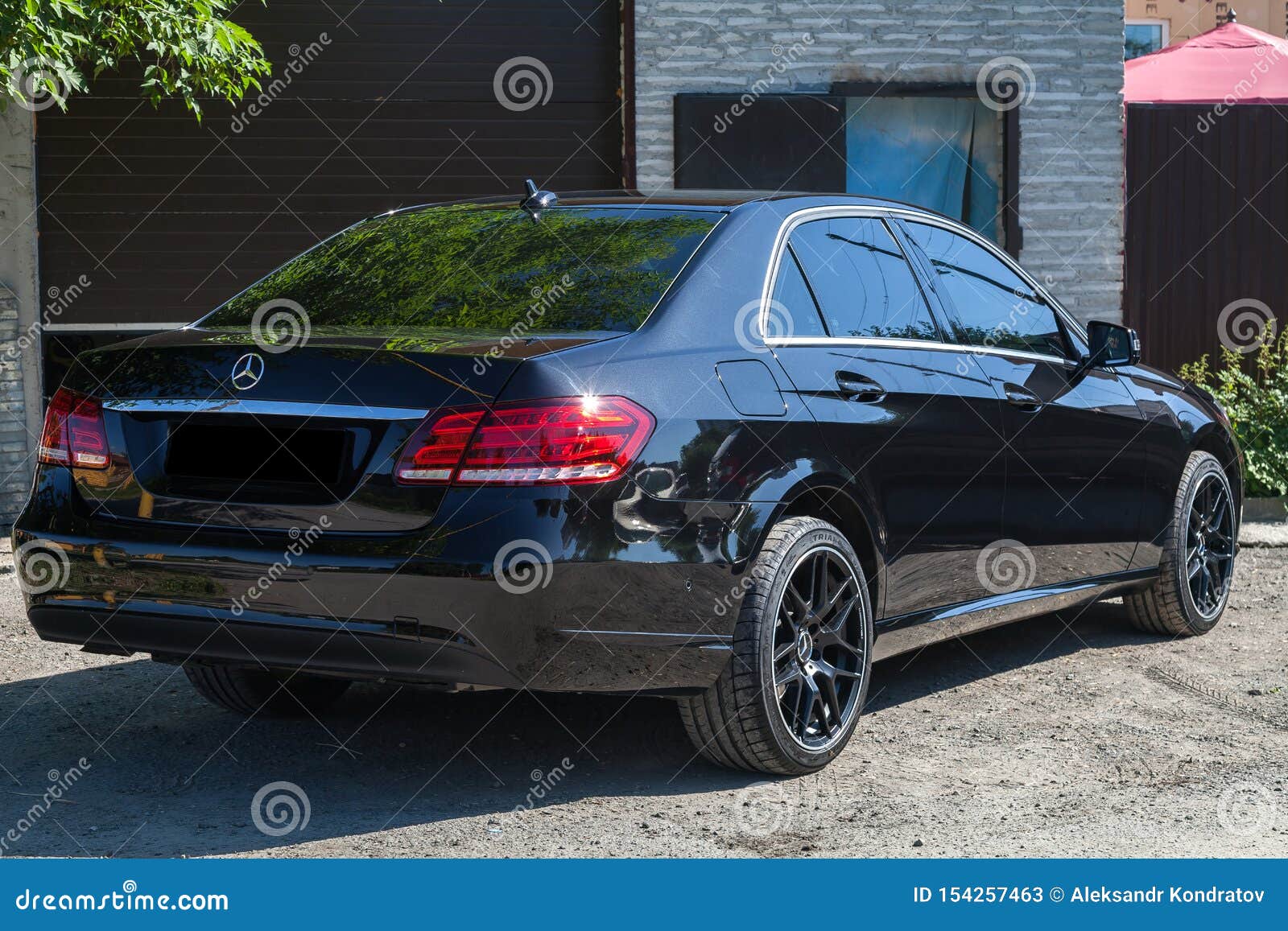 Black Mercedes Benz E Class 50 13 Year Rear View With Dark Gray Interior In Excellent Condition In A Parking Space Near Green Editorial Stock Photo Image Of City Elegant