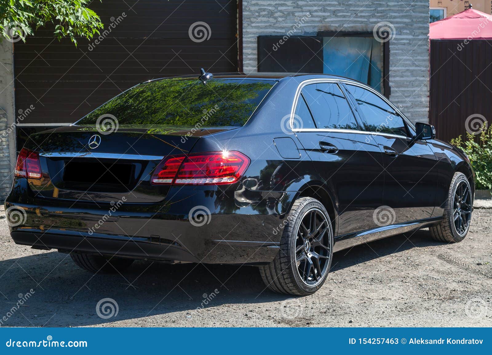 Black Mercedes Benz E Class 50 13 Year Rear View With Dark Gray Interior In Excellent Condition In A Parking Space Near Green Editorial Stock Photo Image Of City Elegant Black Mercedes Benz E Class 50 13 Year Rear View With Dark Gray Interior In Excellent Condition In A Parking Space Near Green Editorial Stock Photo Image Of City Elegant