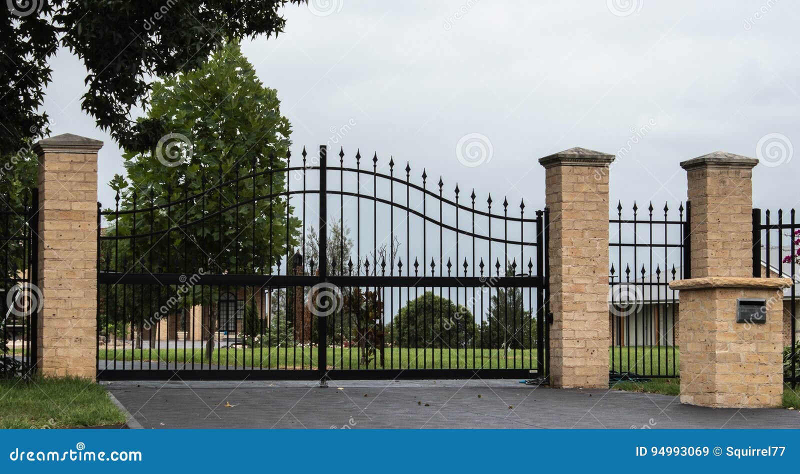 Black Metal Driveway Entrance Gates Set In Fence Stock ...