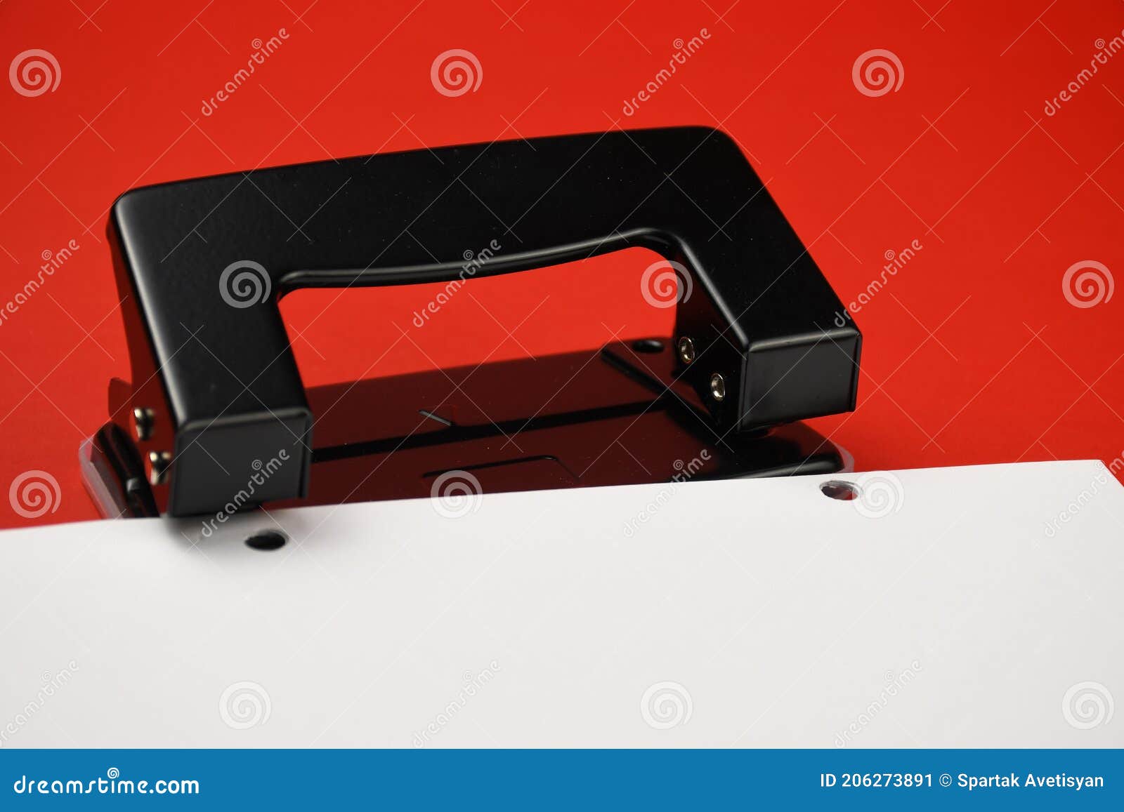 Office paper perforator isolated on white background. Office tool