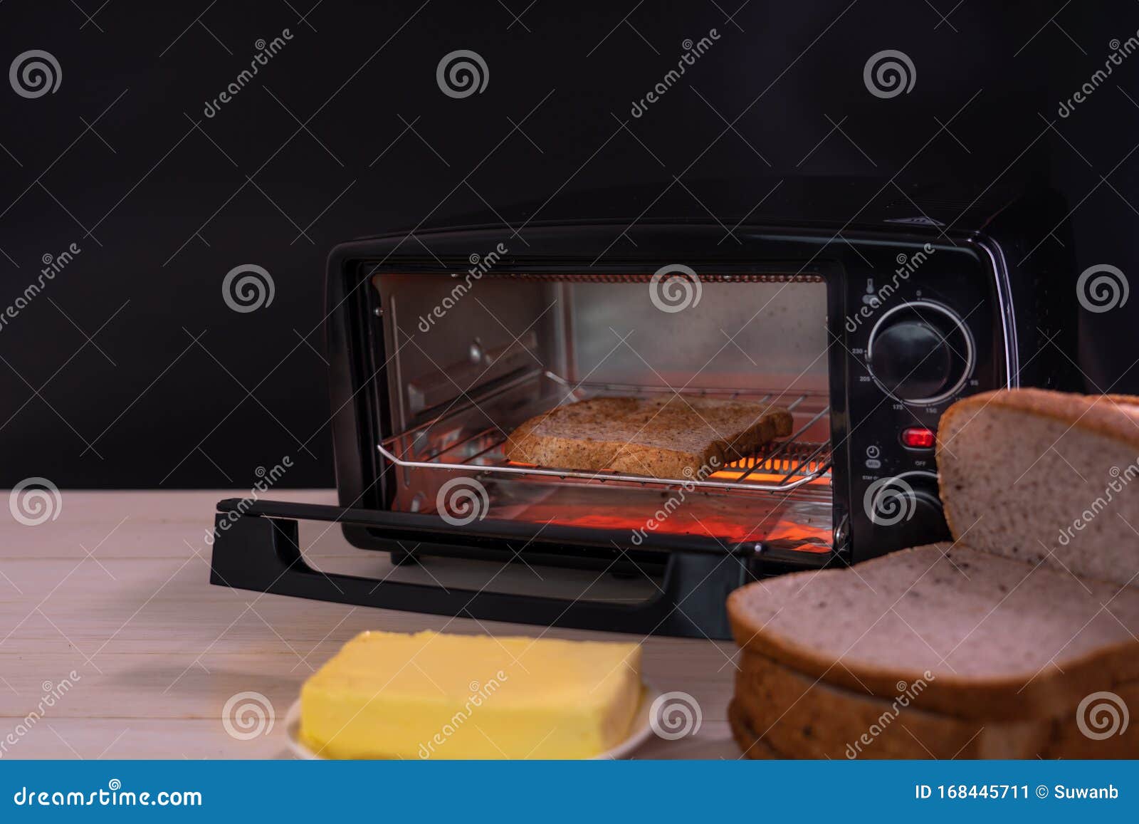 Black Micro Electric Oven with Whole Wheat Bread and Butter Stock Image Image of cuisine