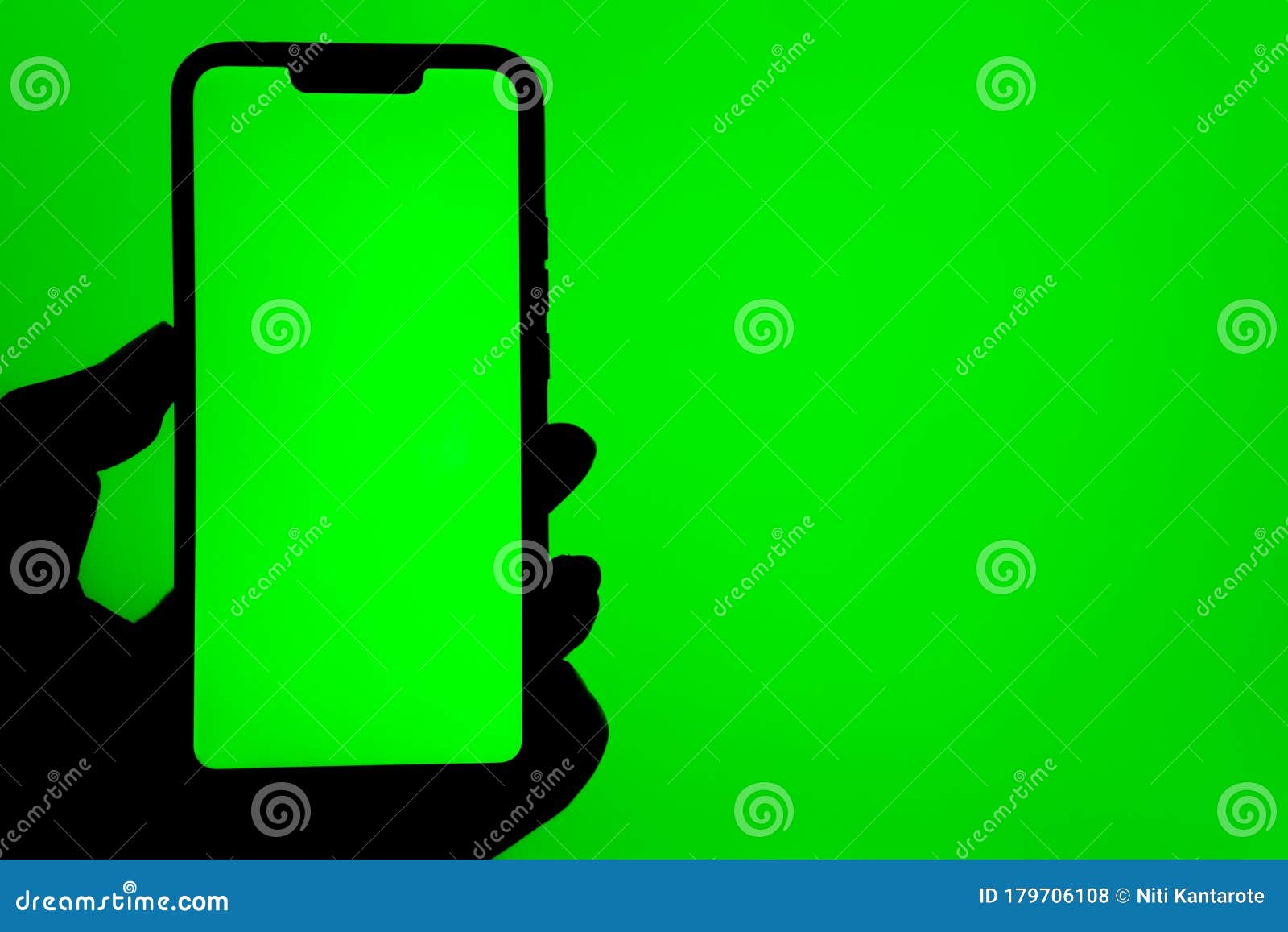 Black Mobile Phone with Green Screen in Man Hand on Green ...