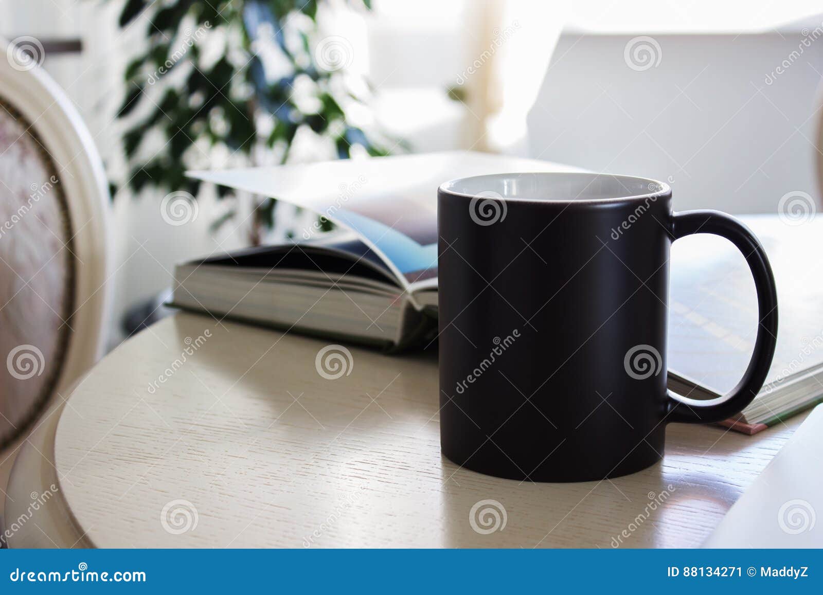 black mug, cup on a table, mockup