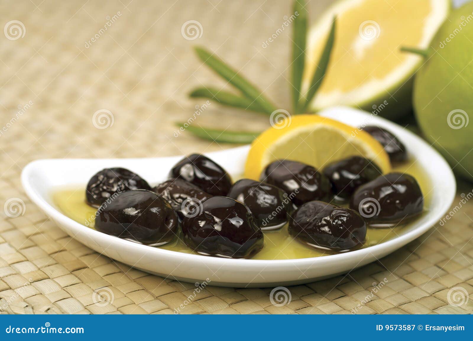 Black olives and olive oil in bowl