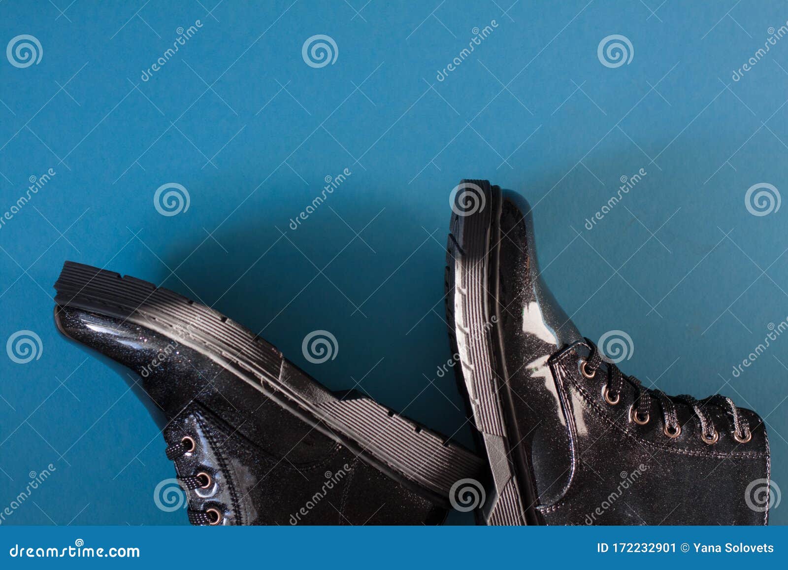 Black Patent Leather Shoes on Blue Background. Stock Image - Image of ...