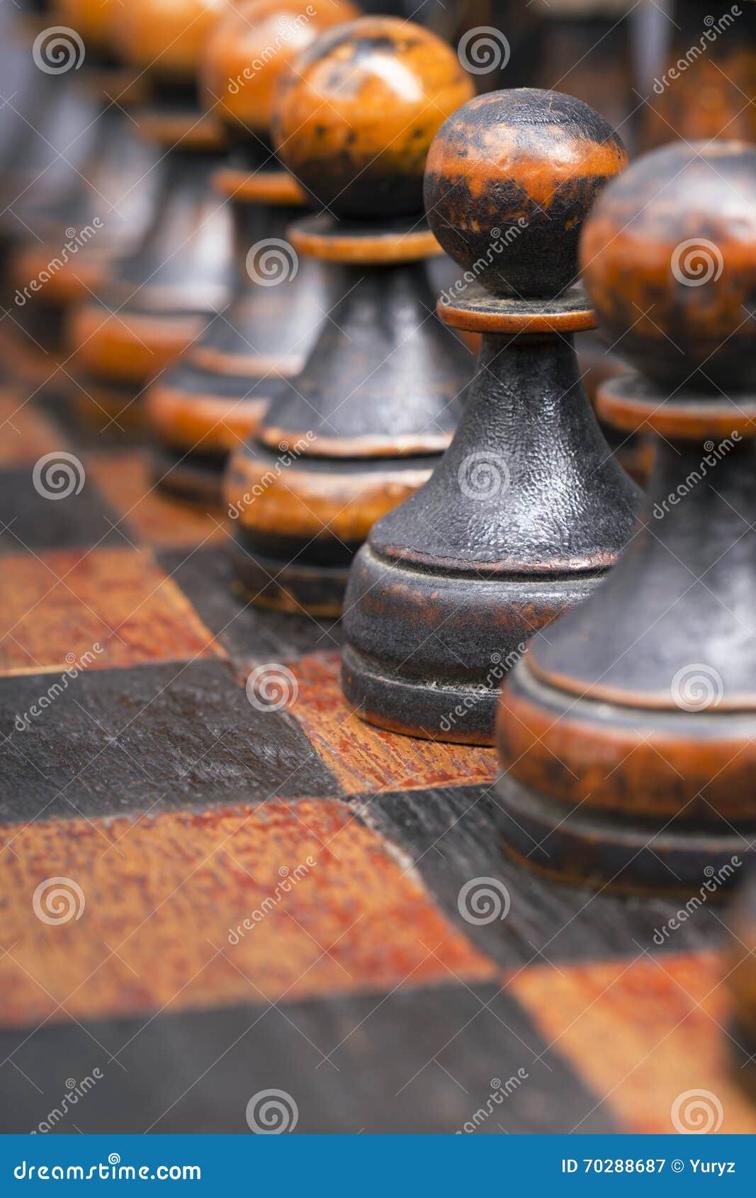 Image of chess game. Businessman looking at compass and pawns