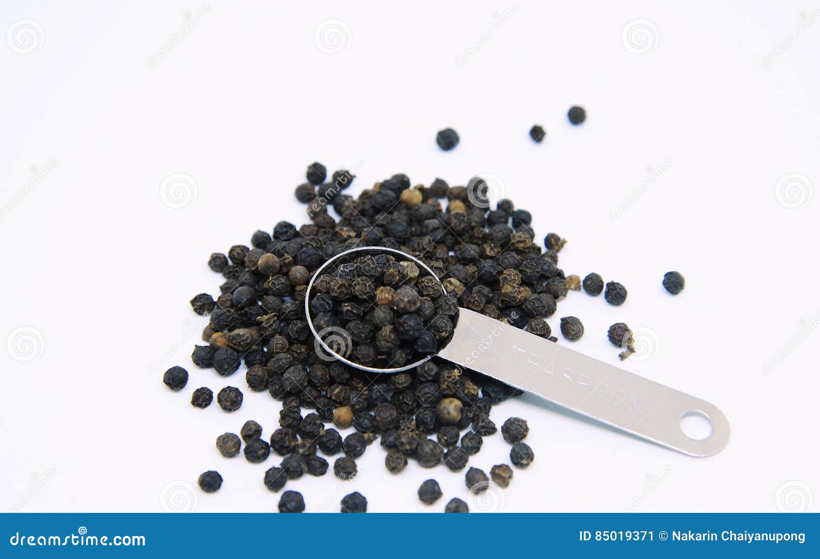Black peppers in teaspoon stock image. Image of component 85019371