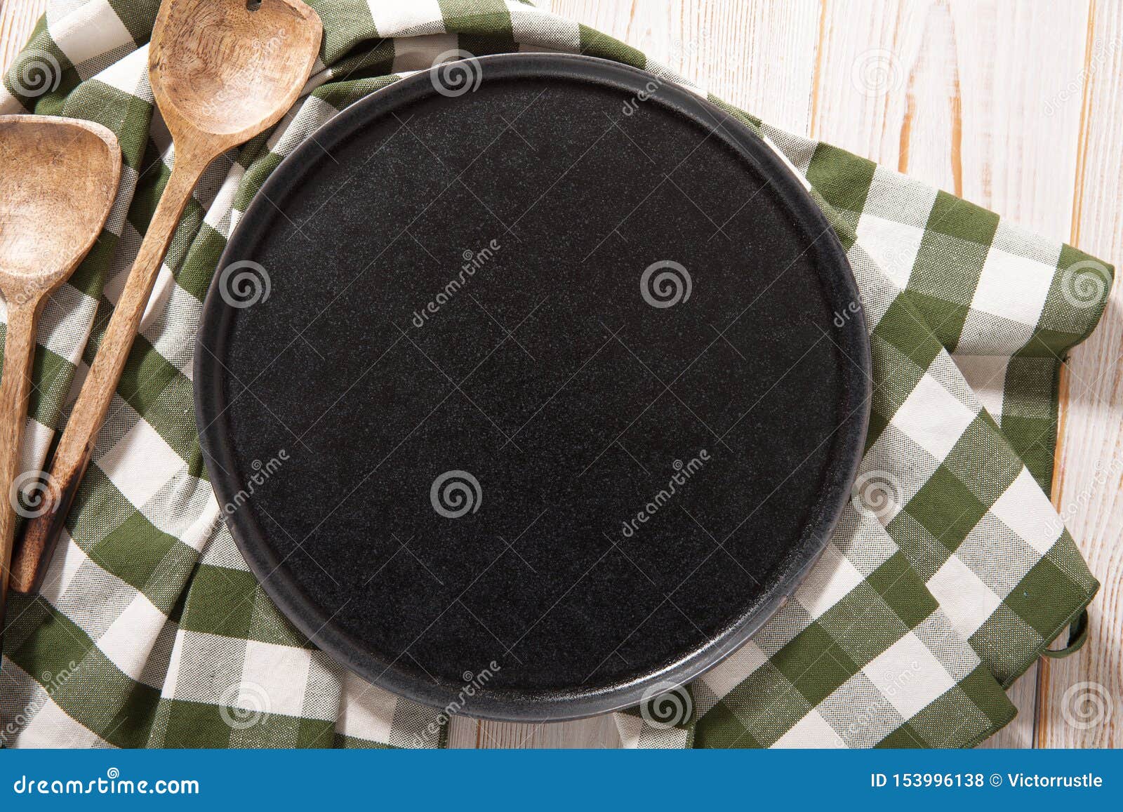 Download Black Plate Or Tray, Or Pizza Board, With Tablecloth On Wooden Table. Top View Mockup Stock ...