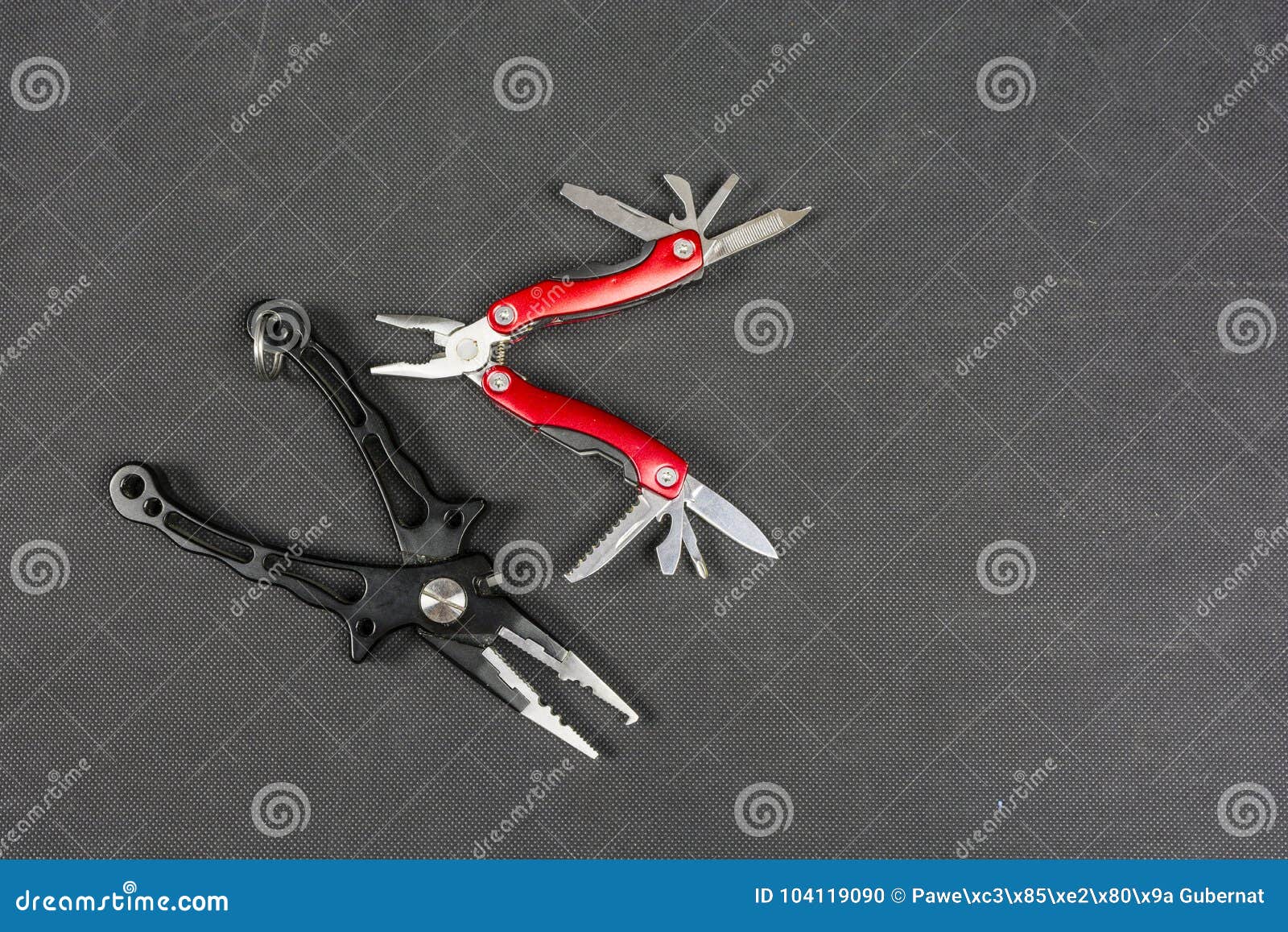 https://thumbs.dreamstime.com/z/black-pliers-red-folding-multifunctional-tool-anglers-place-description-black-pliers-red-folding-multifunctional-104119090.jpg