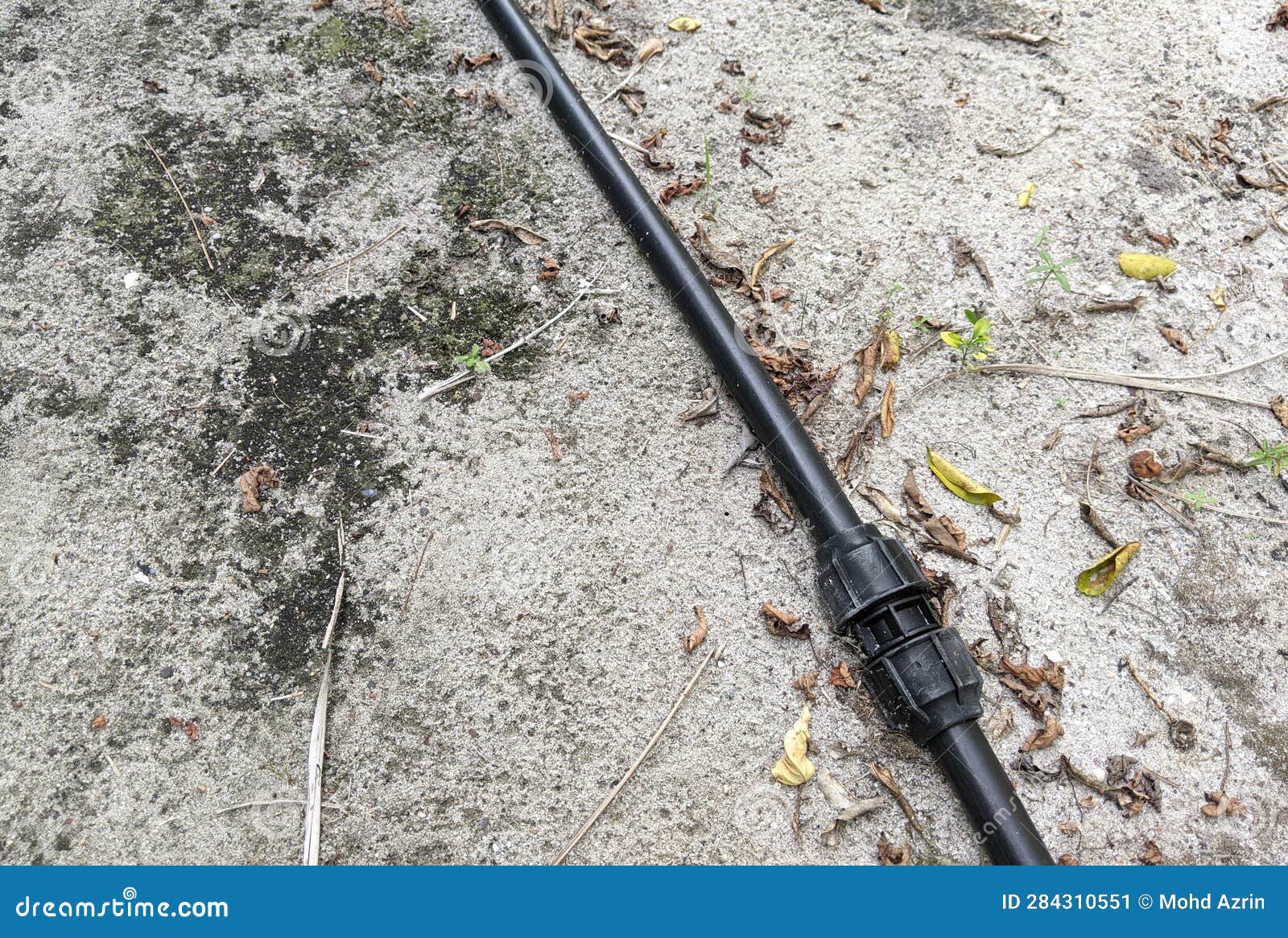 The Black Poly Pipe that is on the Ground after Being Repaired. Stock