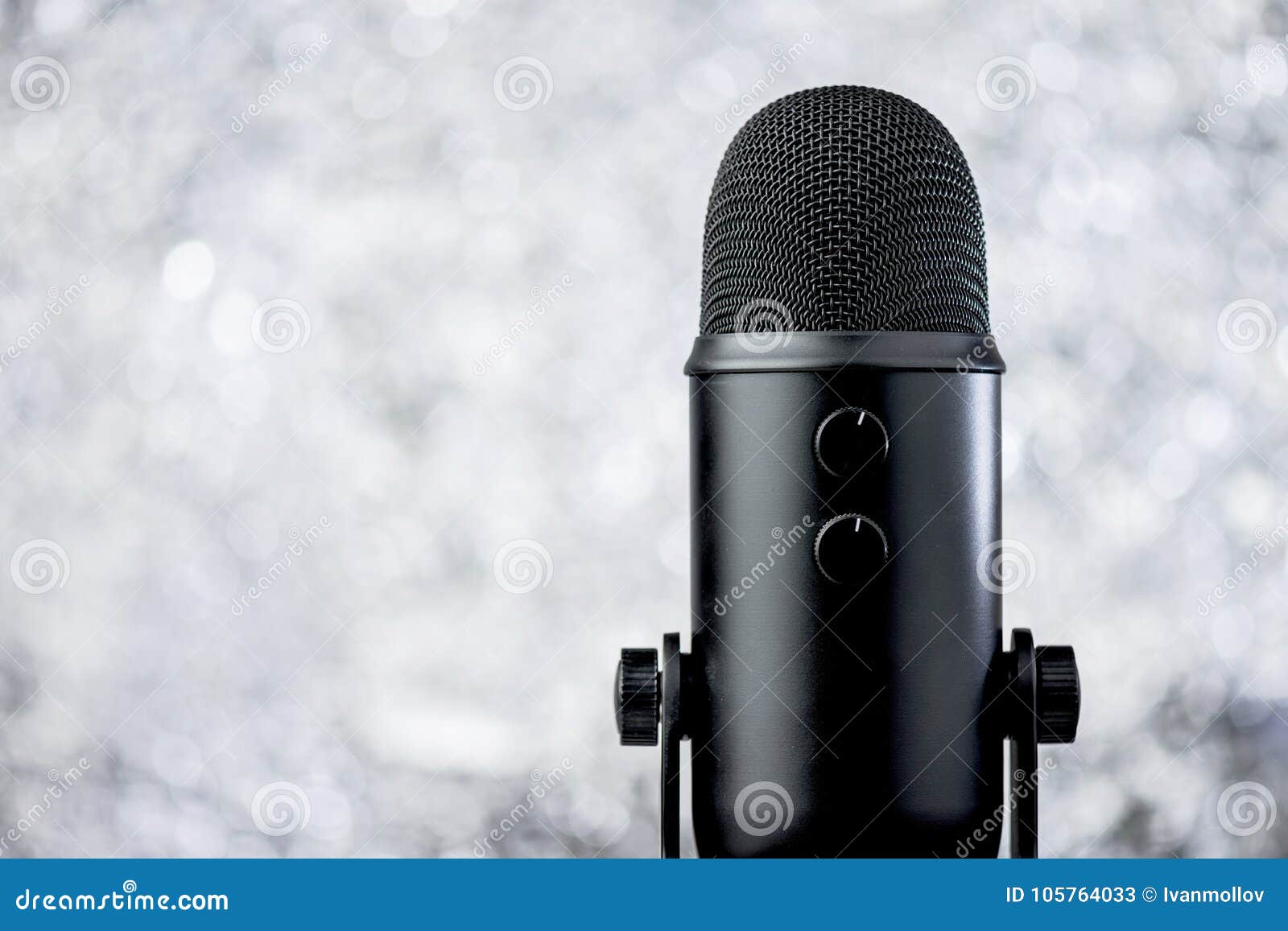 black profesional microphone on blurred background
