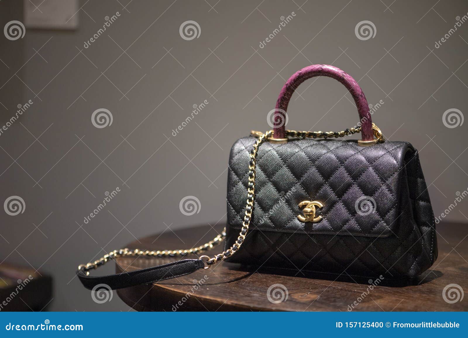 Authentic Black Chanel Bag Sitting on Table Editorial Image - Image of  quilted, chanel: 157125400