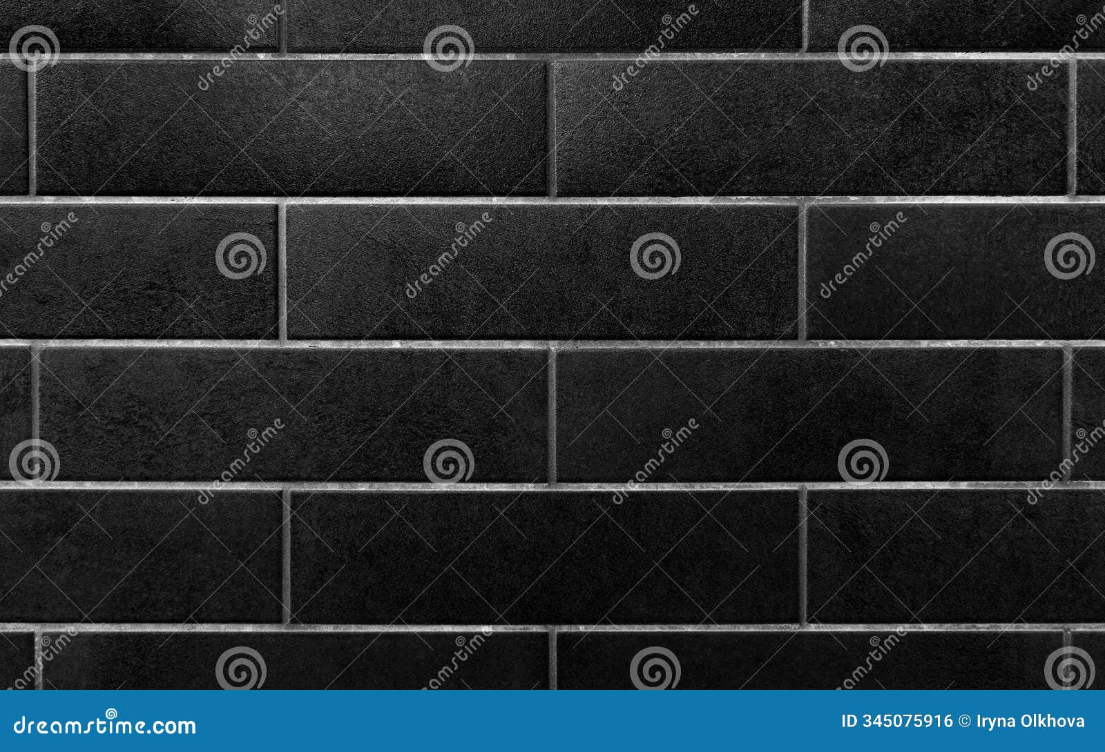 black rectangular tiles wall background. a close-up of a wall featuring black rectangular tiles arranged in a horizontal