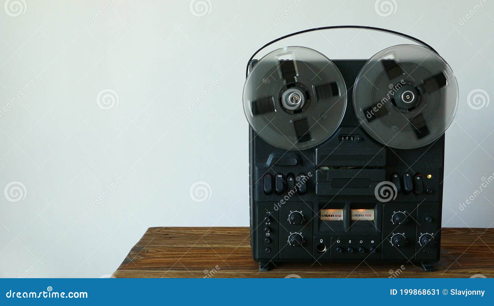 Black Reel To Reel Tape Recorder on a Wooden Table. Rotating Retro Tape.  Vintage Music Player. Spinning Reels Transparent Stock Video - Video of  closeup, black: 199868631