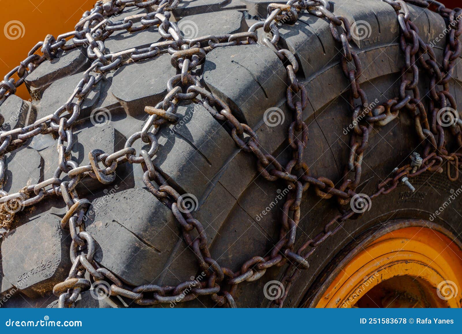 Black Rubber Wheel of Heavy Machinery with Iron Chain Stock Photo Image of metal, profile