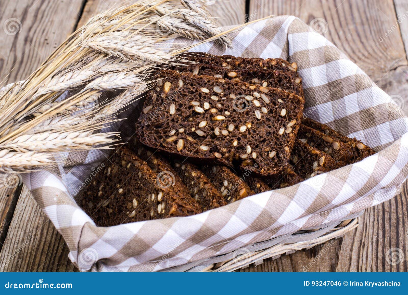 Black Rye Bread with Cereal Seeds on White Background Stock Photo