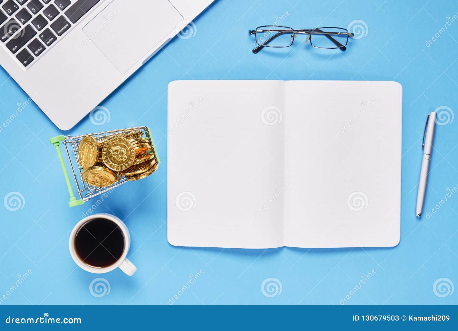 Black Screen Notebook Blank and Laptop Placed Blue Background. Stock