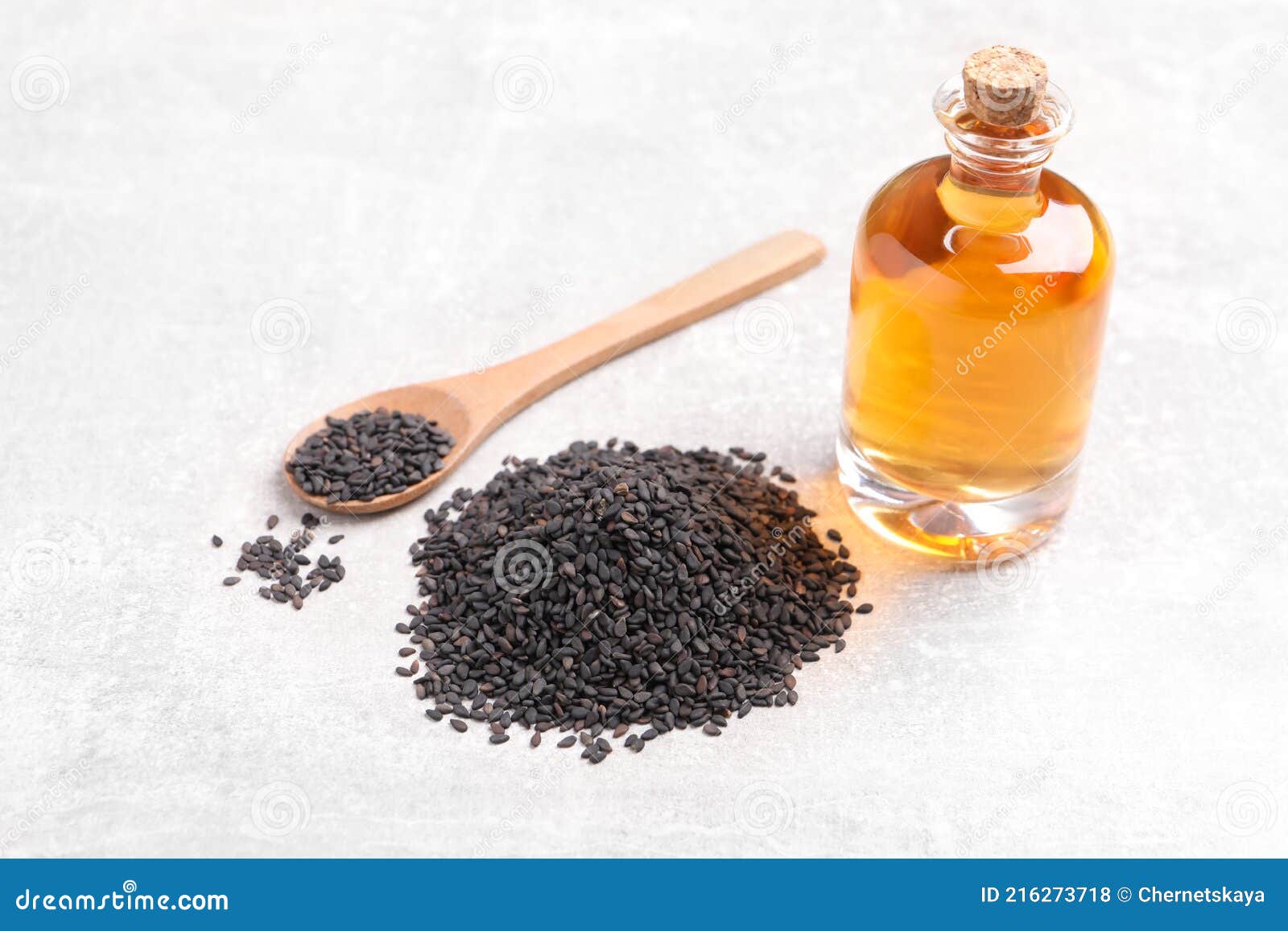 Black Sesame Seeds and Oil on Light Table Stock Photo Image of