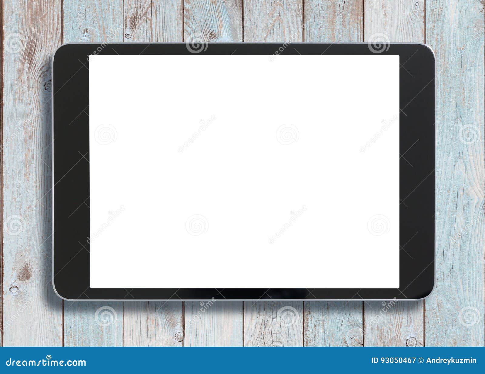 black tablet pc looking similar to ipad on old white wood background