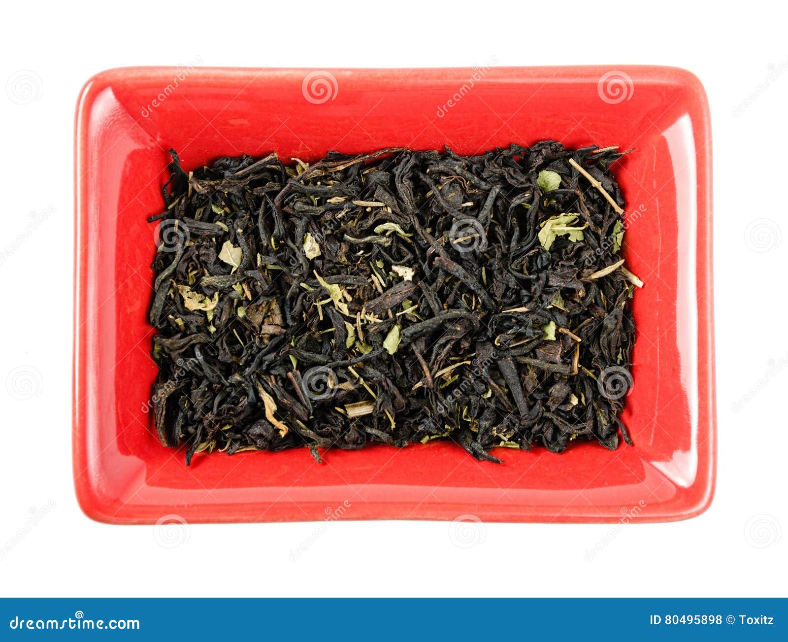 Black Tea Leaves in a Bowl. Isolated Stock Photo Image of green