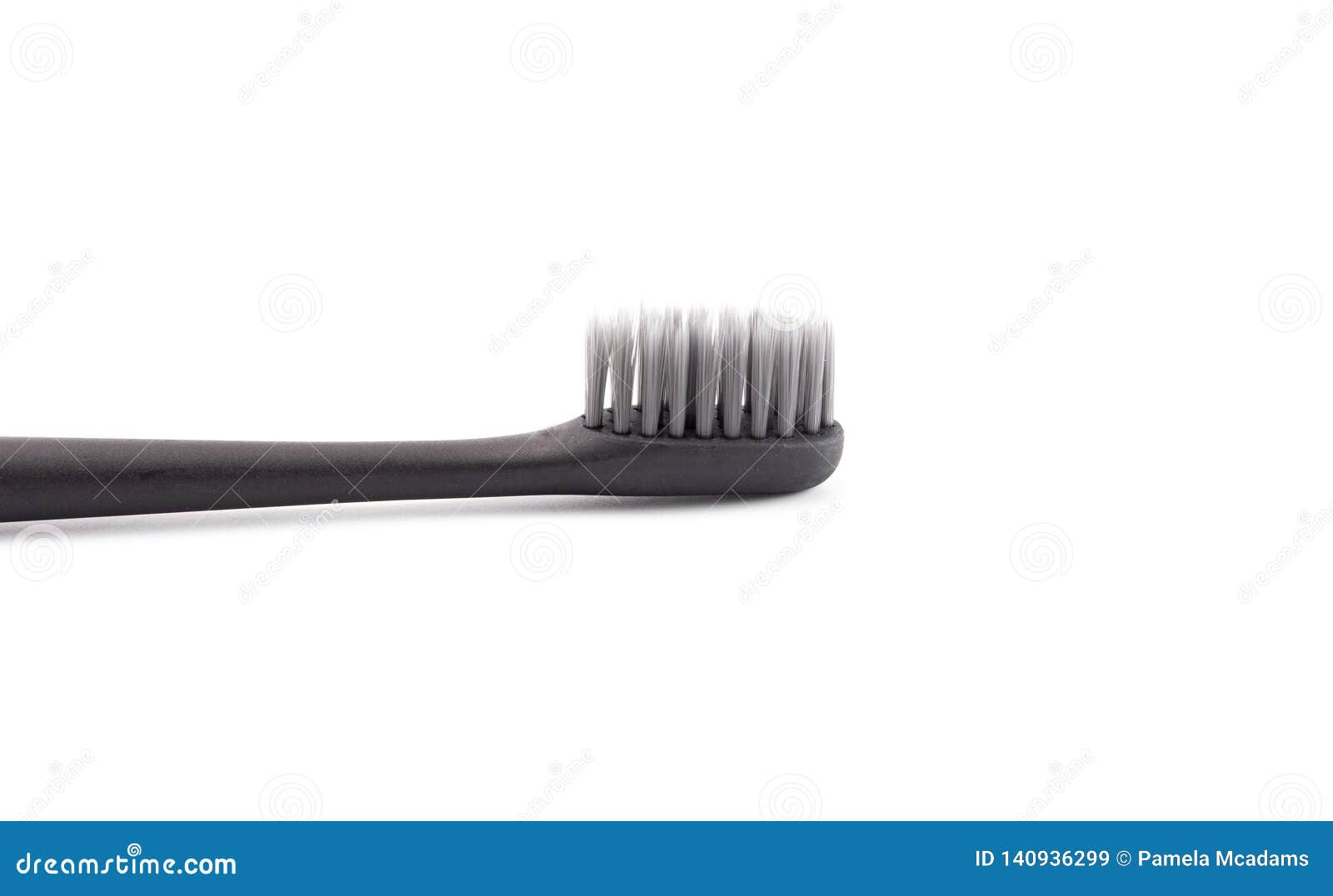 Black Toothbrush without Toothpaste on a White Background Stock Image