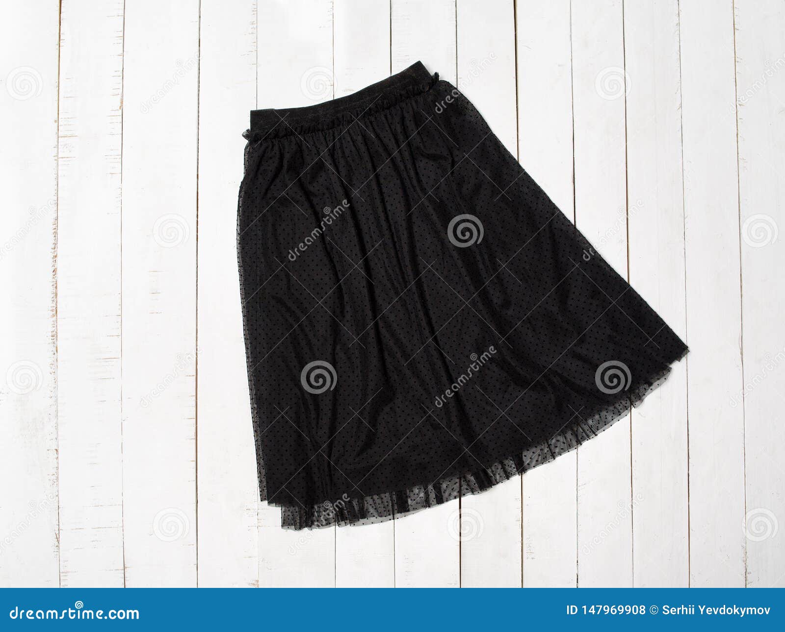 Black Tulle Skirt on White Wooden Background. Top View Stock Photo ...