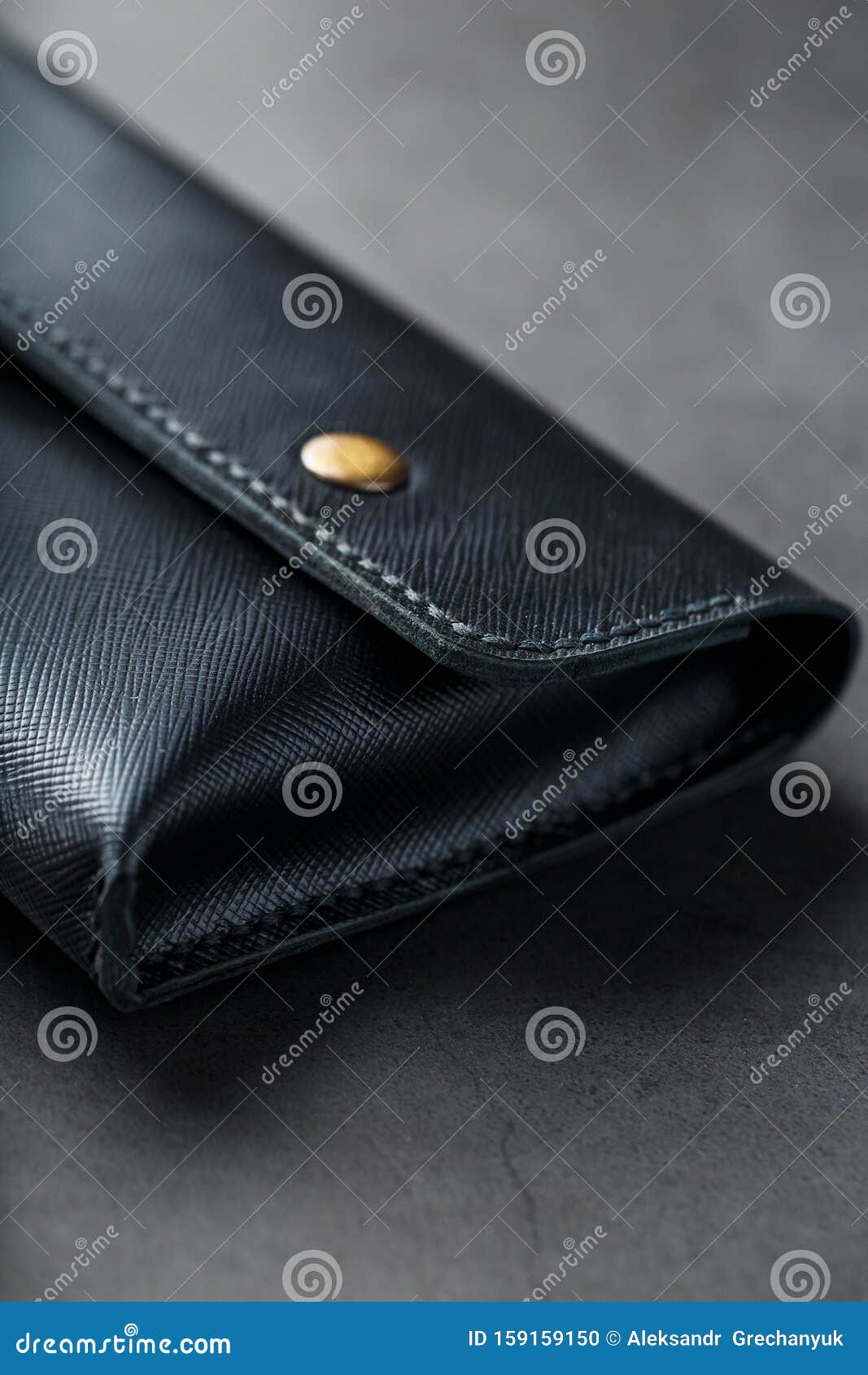 Black Wallet Made of Genuine Leather on a Dark Background. Handmade ...