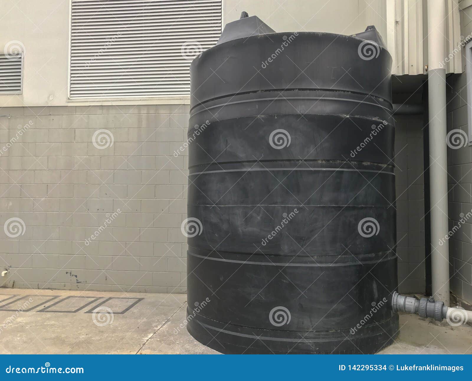 Black water storage drum stock photo. Image of barrels 142295334