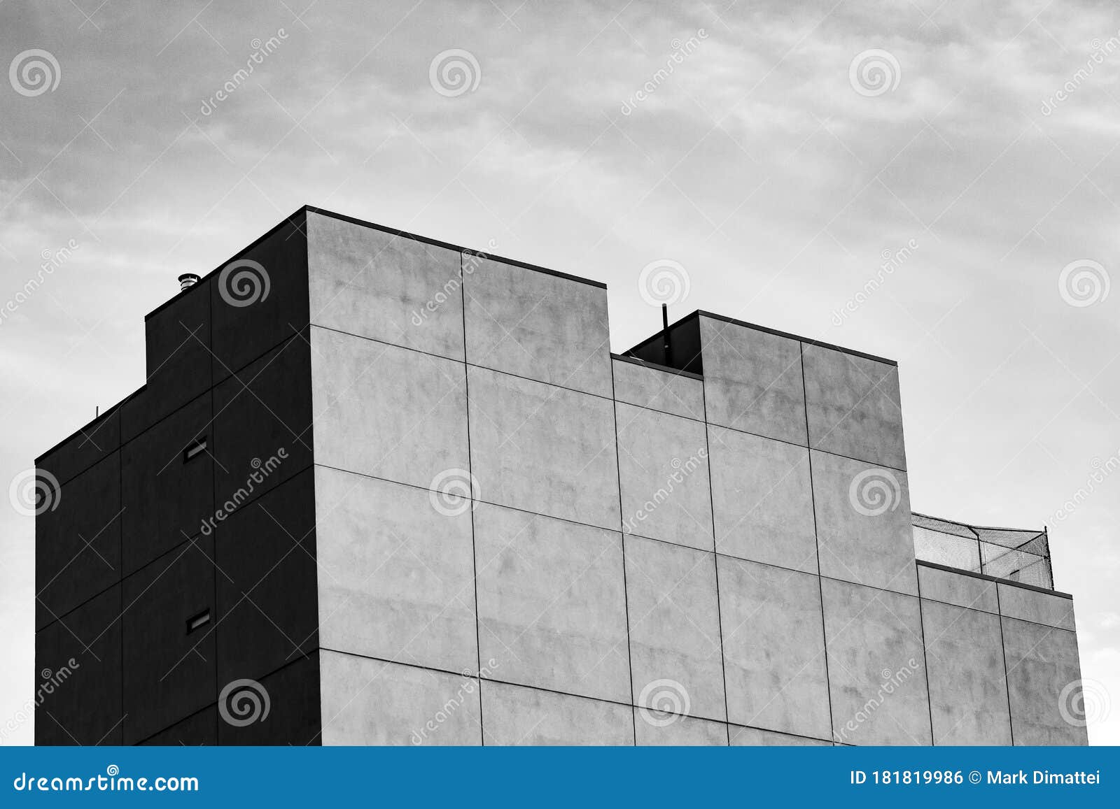 black and white building roof with light cloudy sky background