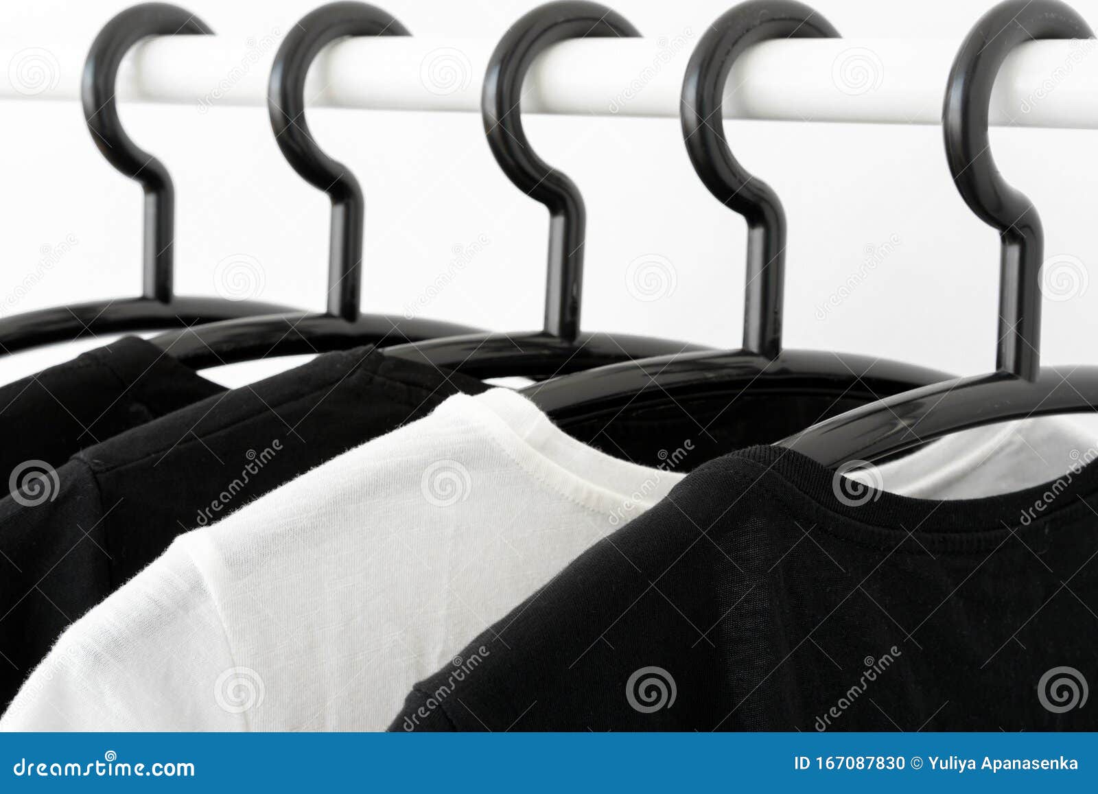 Black And White Color Tone Clothes On Hangers In Wardrobe Stock Photo ...