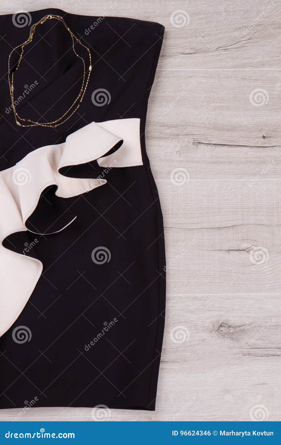 Black and White Dress with Gold Chain. Stock Photo Image of dark